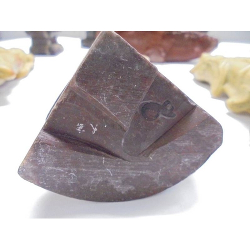 1648 - Eight circa 1900 carved soapstone Chinese figures and a carving of a mountain village.