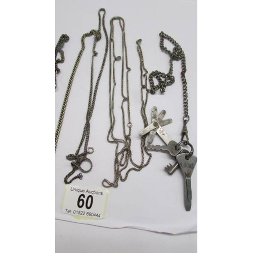 60 - A quantity of white metal watch and other chains.