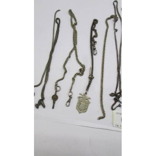 60 - A quantity of white metal watch and other chains.