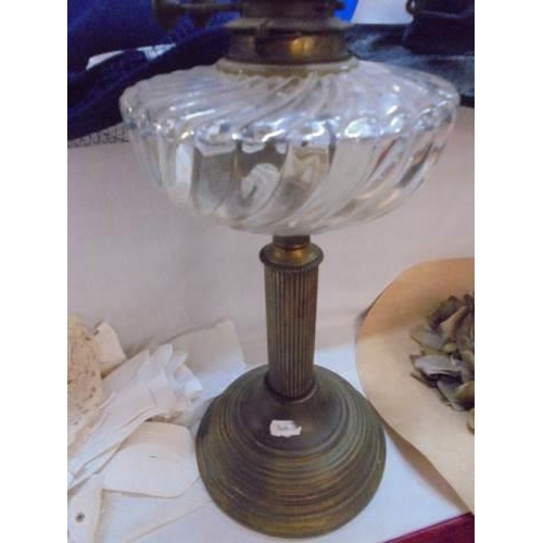 523 - An early 20th century oil lamp with shade.