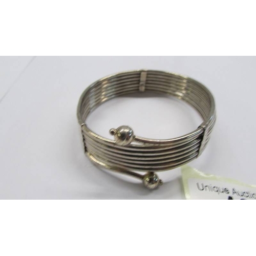 43 - A silver bangle.