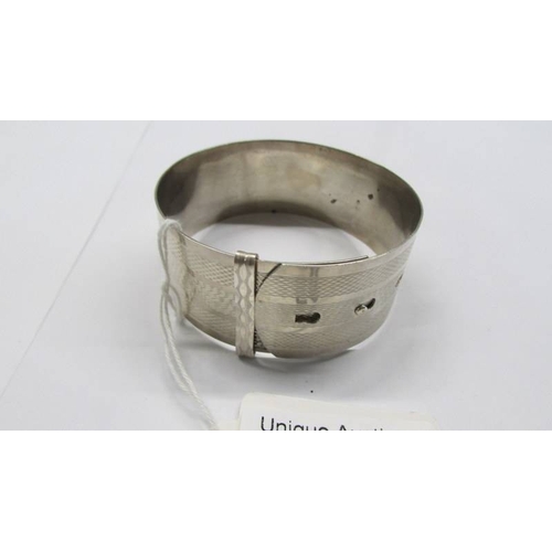 56 - A silver bangle.