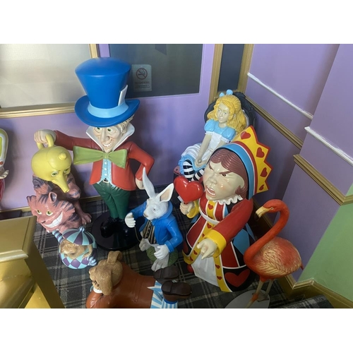 1 - A collection of 9 Alice in Wonderland large figures, including Alice, the Mad Hatter, the Queen, Whi... 