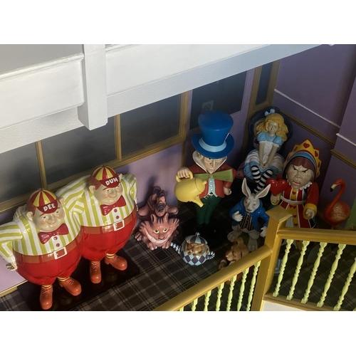 1 - A collection of 9 Alice in Wonderland large figures, including Alice, the Mad Hatter, the Queen, Whi... 