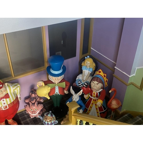 1 - A collection of 9 Alice in Wonderland large figures, including Alice, the Mad Hatter, the Queen, Whi... 