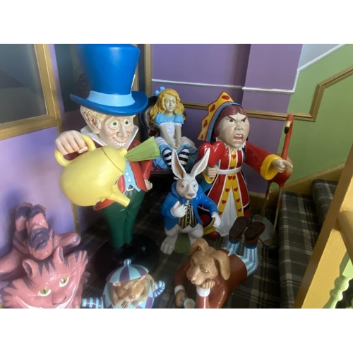 1 - A collection of 9 Alice in Wonderland large figures, including Alice, the Mad Hatter, the Queen, Whi... 