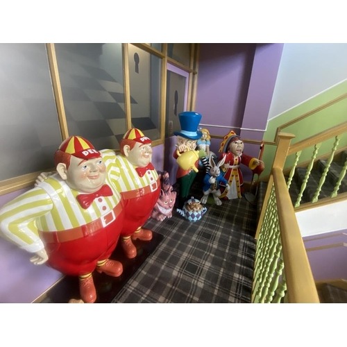 1 - A collection of 9 Alice in Wonderland large figures, including Alice, the Mad Hatter, the Queen, Whi... 