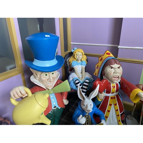 1 - A collection of 9 Alice in Wonderland large figures, including Alice, the Mad Hatter, the Queen, Whi... 