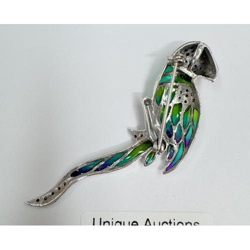 20 - A silver marcasite & plique a jour parrot brooch / pendant