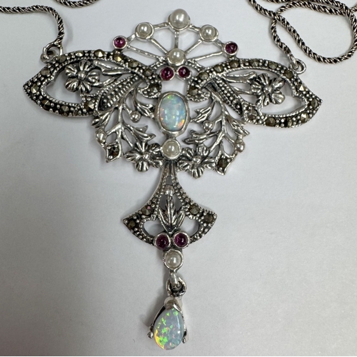 28 - A silver butterfly necklace set with opal cabochon & rubies