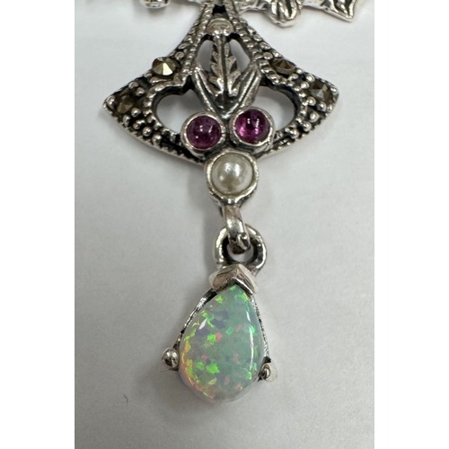 28 - A silver butterfly necklace set with opal cabochon & rubies