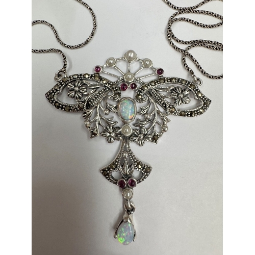 28 - A silver butterfly necklace set with opal cabochon & rubies