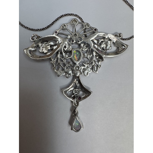 28 - A silver butterfly necklace set with opal cabochon & rubies