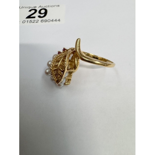 29 - A 14ct yellow gold freshwater pearl & ruby ring (6.68 grams)