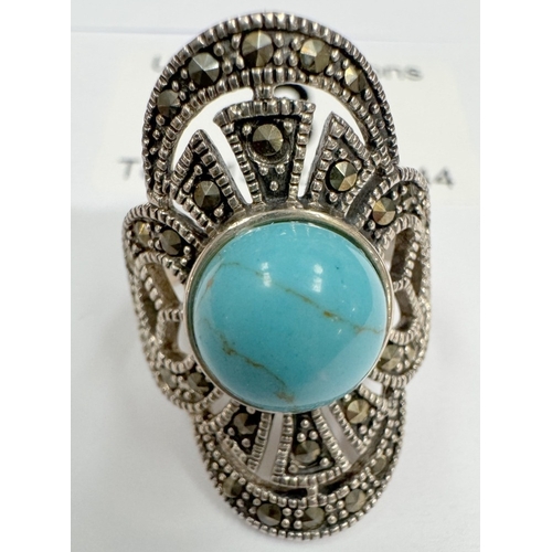 8 - A silver marcasite ring with large turquoise cabachon (6.77 grams)
