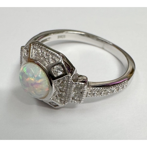9 - A silver CZ & opal panelled ring (3.45 grams)