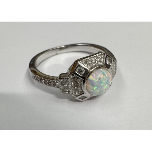 9 - A silver CZ & opal panelled ring (3.45 grams)