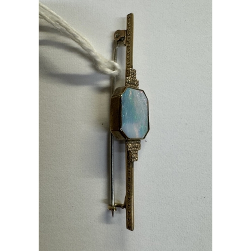 37 - A 9ct gold bar brooch with inset large opal. 2.8 grams