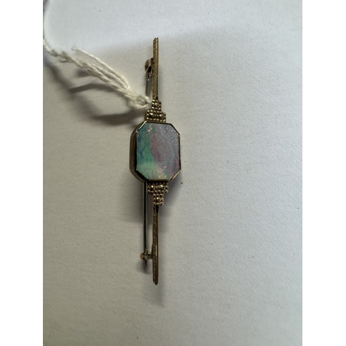 37 - A 9ct gold bar brooch with inset large opal. 2.8 grams
