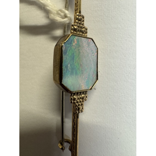 37 - A 9ct gold bar brooch with inset large opal. 2.8 grams