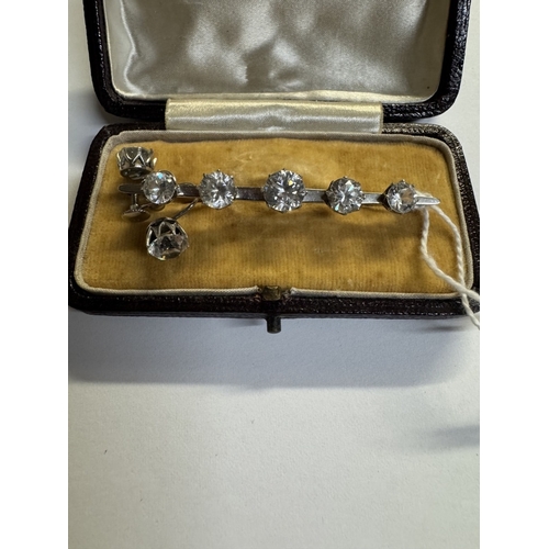39 - A 9ct white gold 5 stone brooch with matching earrings