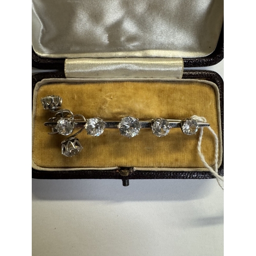 39 - A 9ct white gold 5 stone brooch with matching earrings