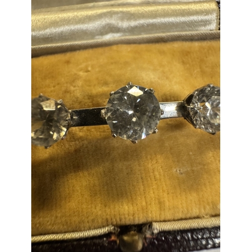 39 - A 9ct white gold 5 stone brooch with matching earrings