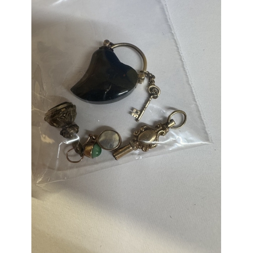 41 - An unmarked white gold brooch (tests as gold), A polished stone necklace etc
