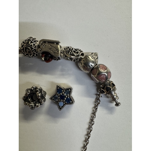 44 - A silver Pandora charm bracelet with 15 charms (Approx 70 grams)