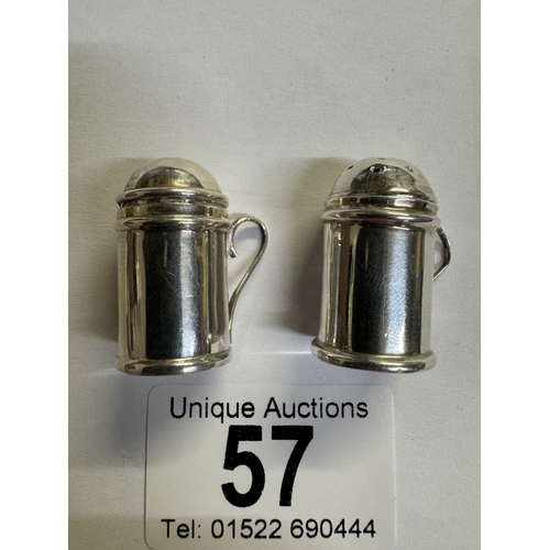 57 - A miniature silver salt & pepper in the shape of beer tankards