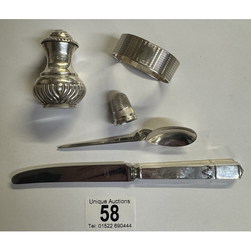 58 - A quantity of silver items including napkin ring, spoon, pepperette, thimble & silver handle knife a... 