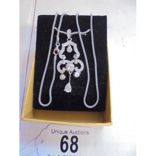 68 - A good quality silver pendant on a silver chain.