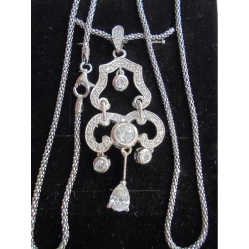 68 - A good quality silver pendant on a silver chain.