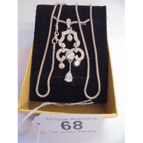 68 - A good quality silver pendant on a silver chain.