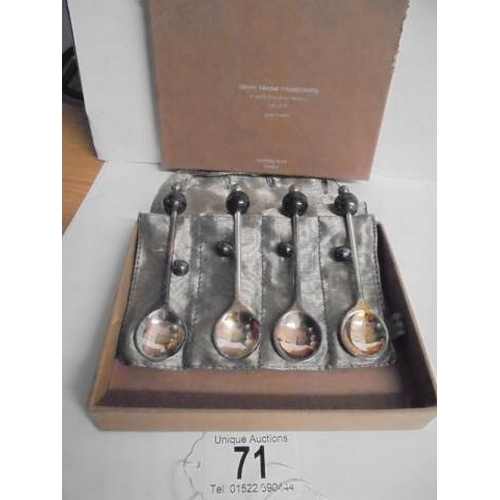 71 - A boxed set of four Demi Tasse teaspoons supplied by Bombay Duck, London.