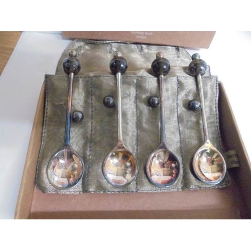 71 - A boxed set of four Demi Tasse teaspoons supplied by Bombay Duck, London.