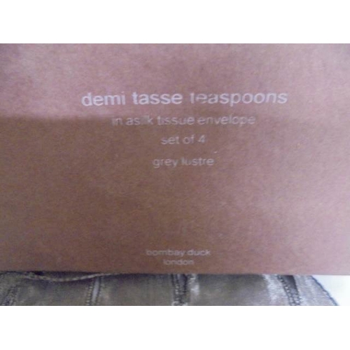 71 - A boxed set of four Demi Tasse teaspoons supplied by Bombay Duck, London.