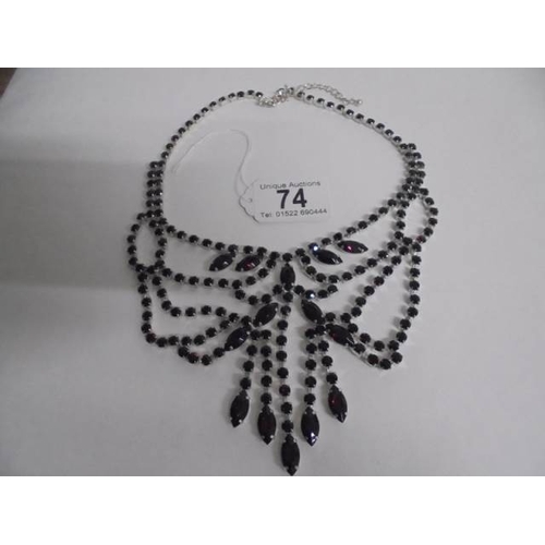 74 - A good quality dark red stone set necklace.