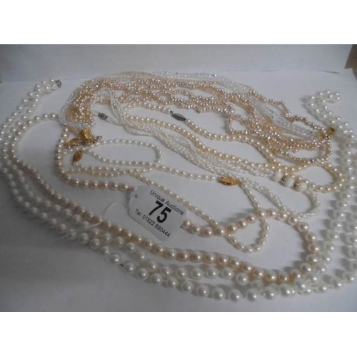 75 - A nice lot of mainly pearl necklaces all in good condition.