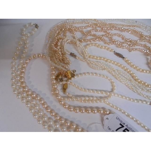 75 - A nice lot of mainly pearl necklaces all in good condition.
