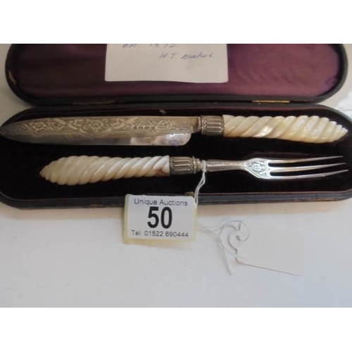 50 - A cased serving knife and fork with silver blades and mother of pearl handles, Birmingham 1872, Make... 