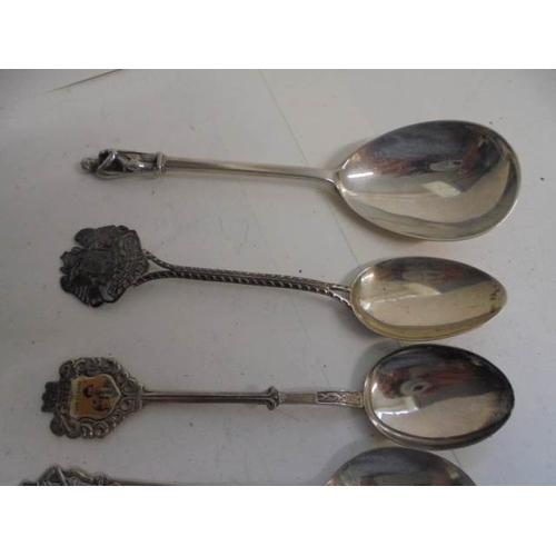 53 - Seven silver spoons including souvenir examples, and 1 silver plate total weight 95 grams