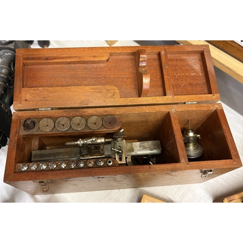 A watchmakers lathe, staking tool sets, refractometer (For testing gem ...