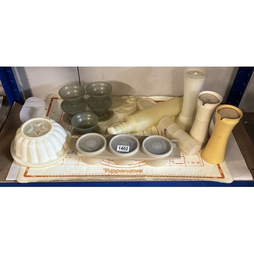 A collection of vintage Tupperware including unusual items