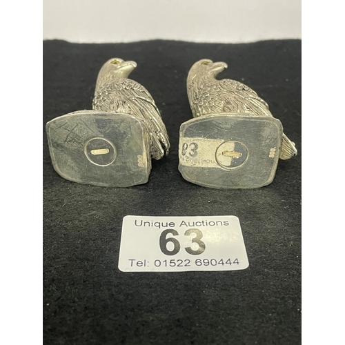63 - A pair of silver plated eagle style condiments