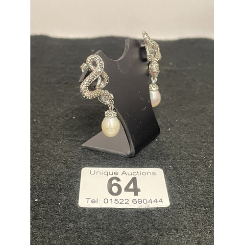 64 - A pair of silver and freshwater pearl earrings inset with rubies