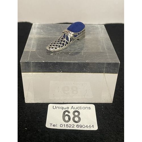 68 - A silver shoe pin cushion
