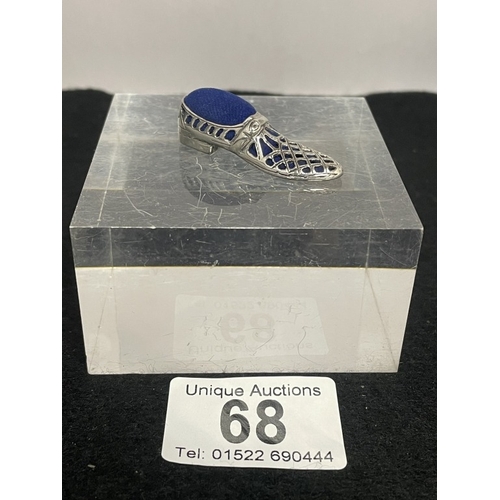 68 - A silver shoe pin cushion