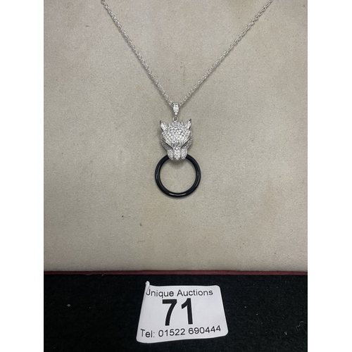 71 - A silver & cz designer style pendant necklace with emerald eyes
