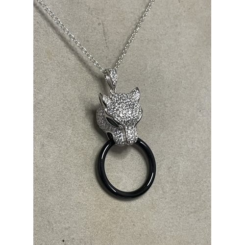 71 - A silver & cz designer style pendant necklace with emerald eyes